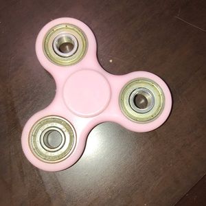 A pinkish purple fidget spinner